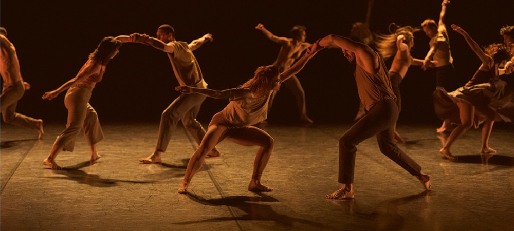 A group of dancers on stage.