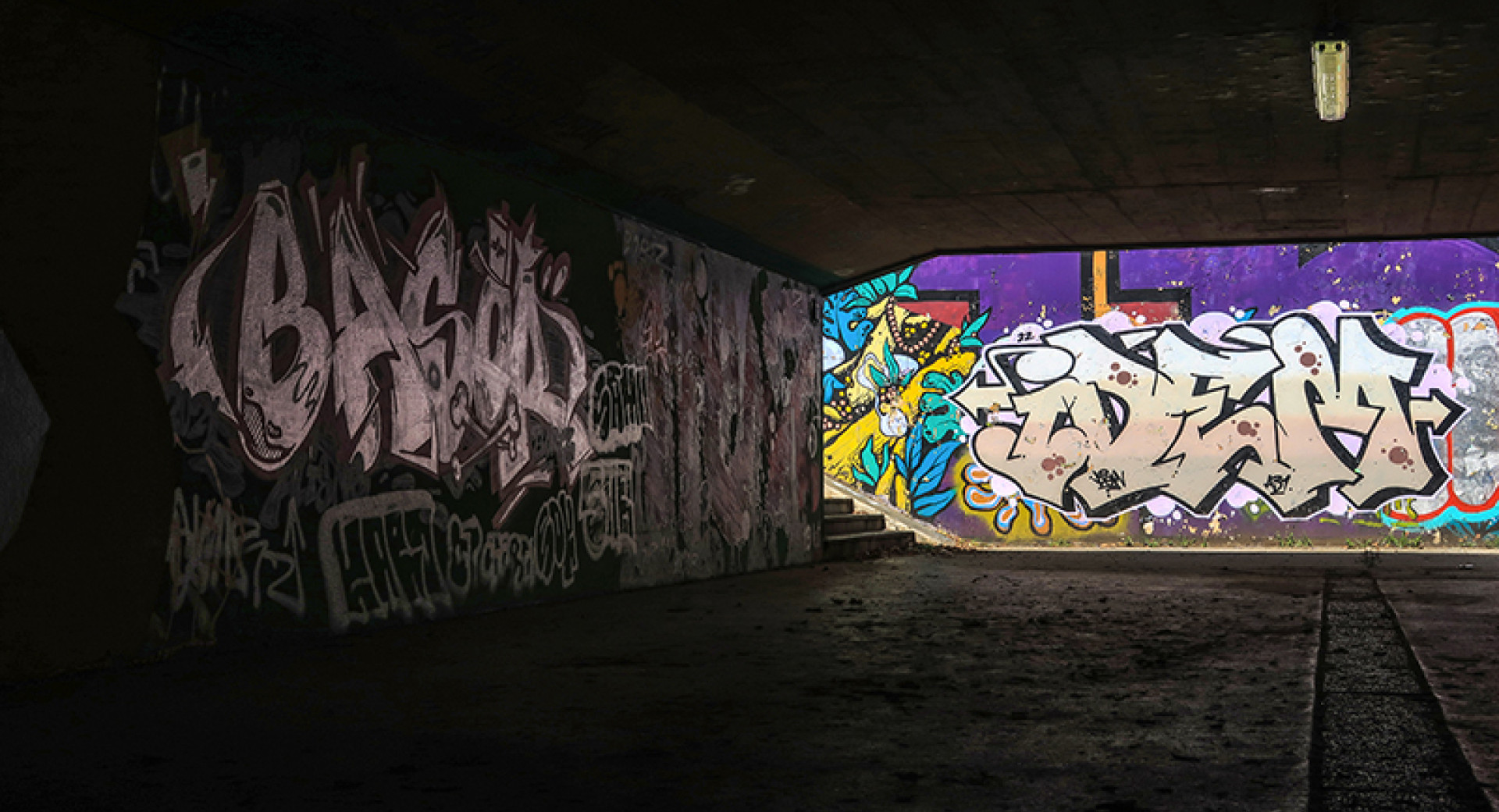 Graffiti on the walls of the underpass.