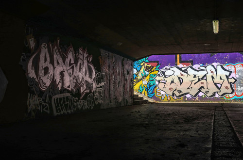 Graffiti on the walls of the underpass.