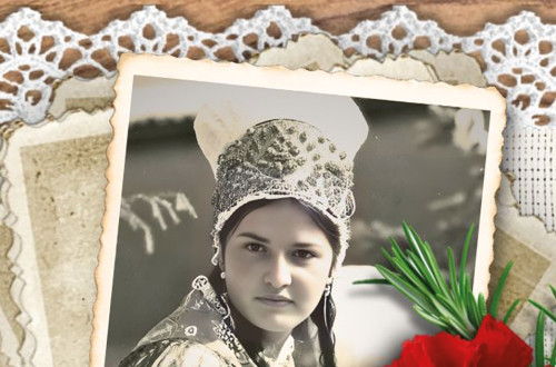 Black-and-white portrait of a girl in traditional costume.