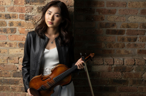 Woman holding a violin.