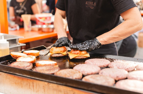 Hamburgers on a barbecue.