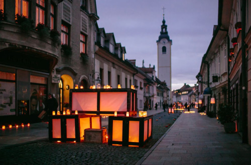 The festive lights are scattered along the city street.