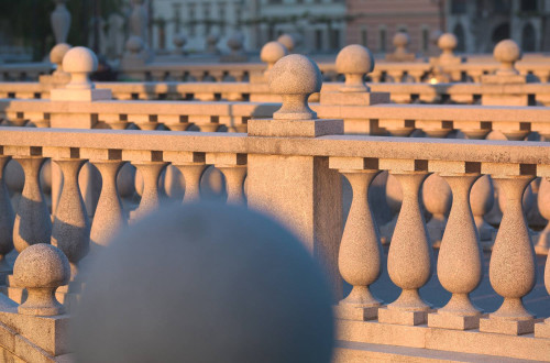 A stone railing of a bridge.