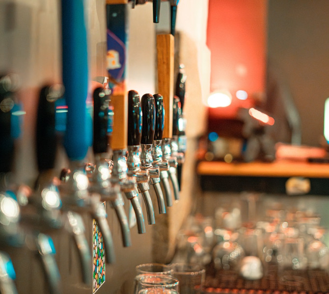 Several tap faucets in a row.