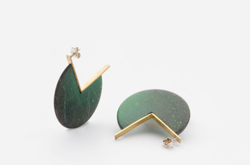 A pair of modern earrings with green circular elements and gold geometric details.