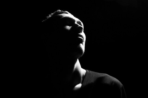 A black-and-white portrait of a young man.