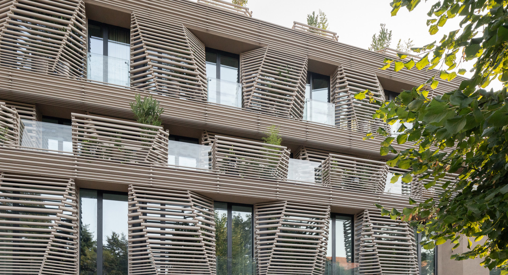 The balconies and windows of the hotel with brown details.