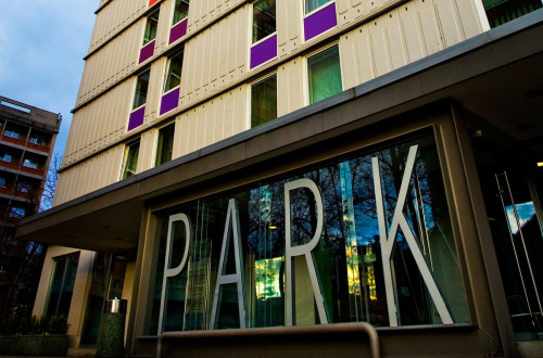 The exterior of a building with a sign that says "Park."