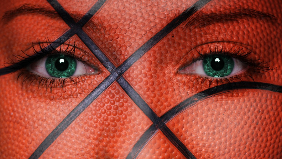 A woman's face with a basketball pattern.