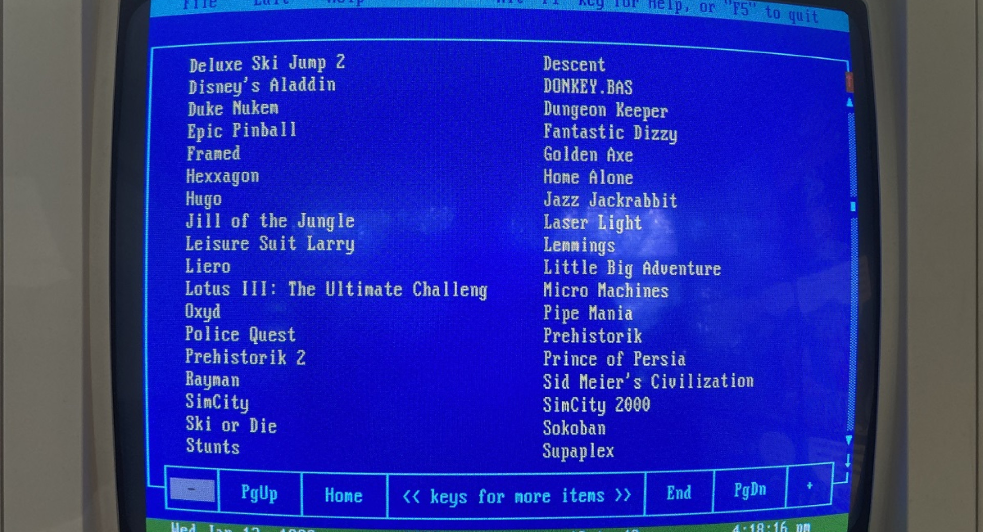 Blue retro computer screen with a list of games.