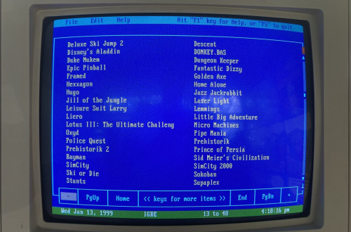 Blue retro computer screen with a list of games.